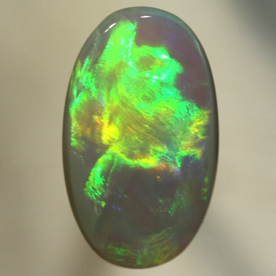 SOLID SEMI BLACK OPAL Very large rolling flashes showing a neon Flame pattern